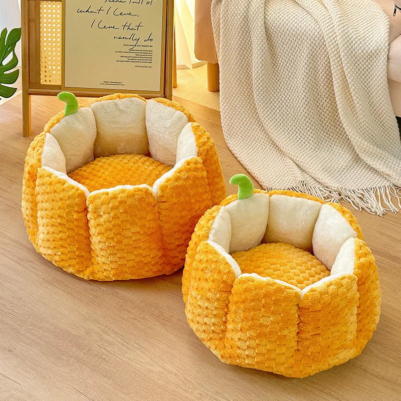 Orange pumpkin-shaped enclosed pet bed for cats or small dogs with cotton filling.