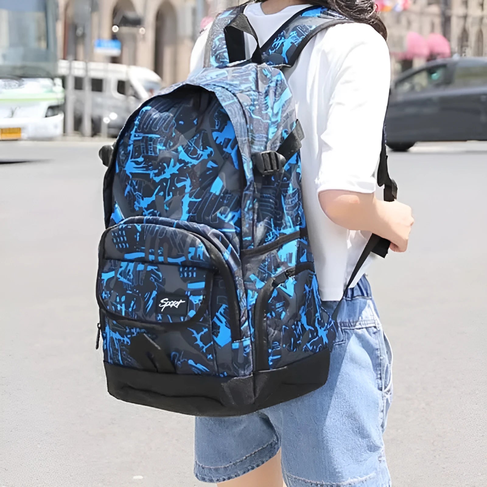 Blue and red classic nylon backpack with large main compartment for school and travel.