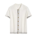 White short-sleeve cardigan with dark contrast colour lapels, buttoned front, on a hanger.