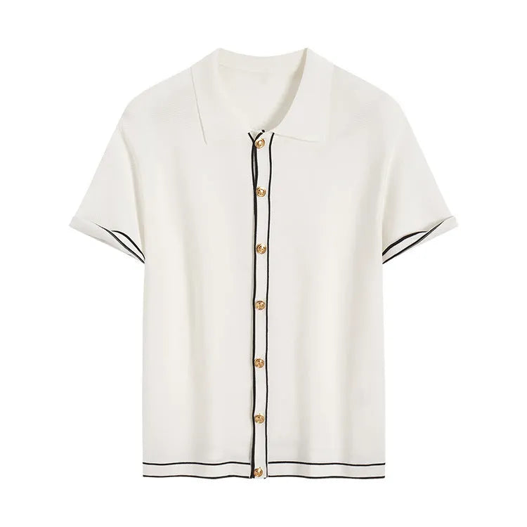 White short-sleeve cardigan with dark contrast colour lapels, buttoned front, on a hanger.