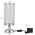 Modern crystal table lamp with hollow-carved design, metal base, gold finish, on bedside table
