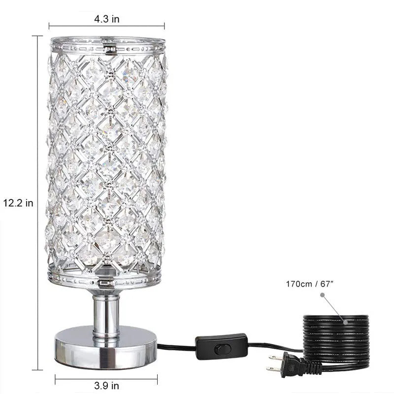 Modern crystal table lamp with hollow-carved design, metal base, gold finish, on bedside table