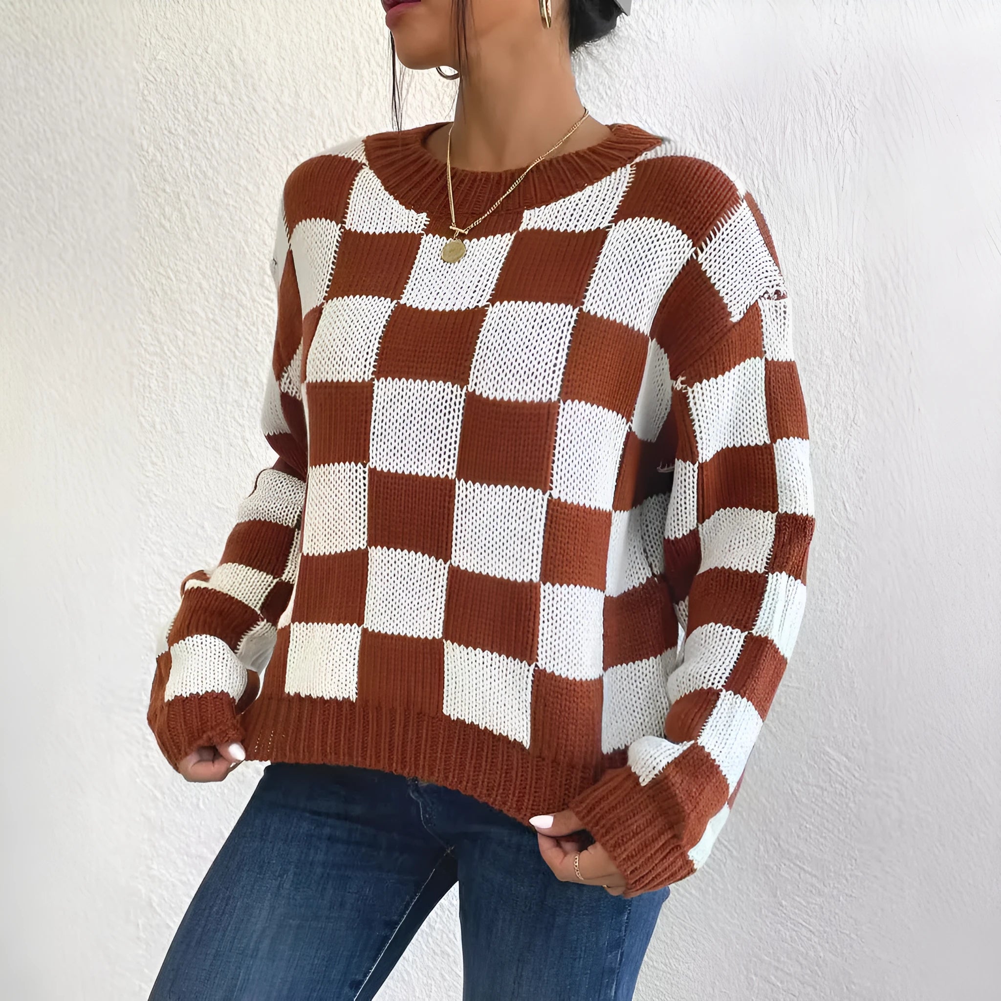 Dark brown plaid women's loose pullover sweater with round neck and long sleeves.