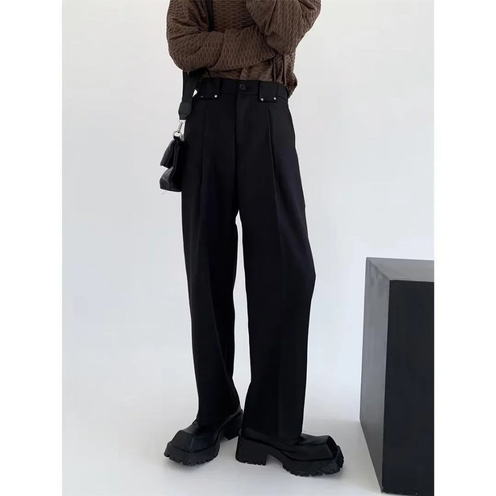 Women's black high-waisted cropped suit pants with draping effect, sizes M-3XL, on display