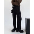 Women's black high-waisted cropped suit pants with draping effect, sizes M-3XL, on display