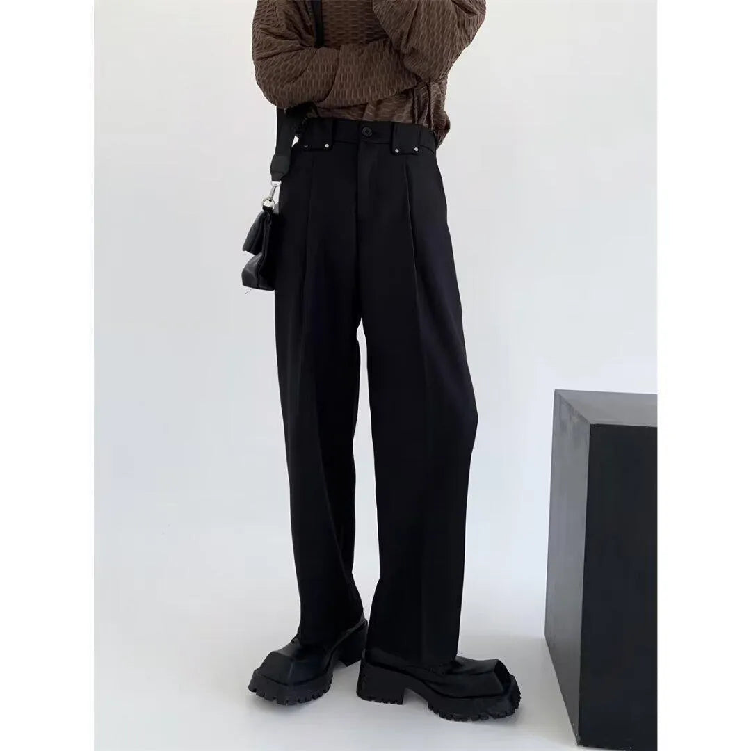 Women's black high-waisted cropped suit pants with draping effect, sizes M-3XL, on display