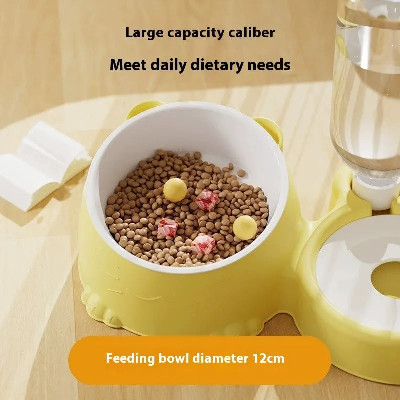 Green automatic pet feeder with white ceramic food bowl and stainless steel water compartment on a stable base.