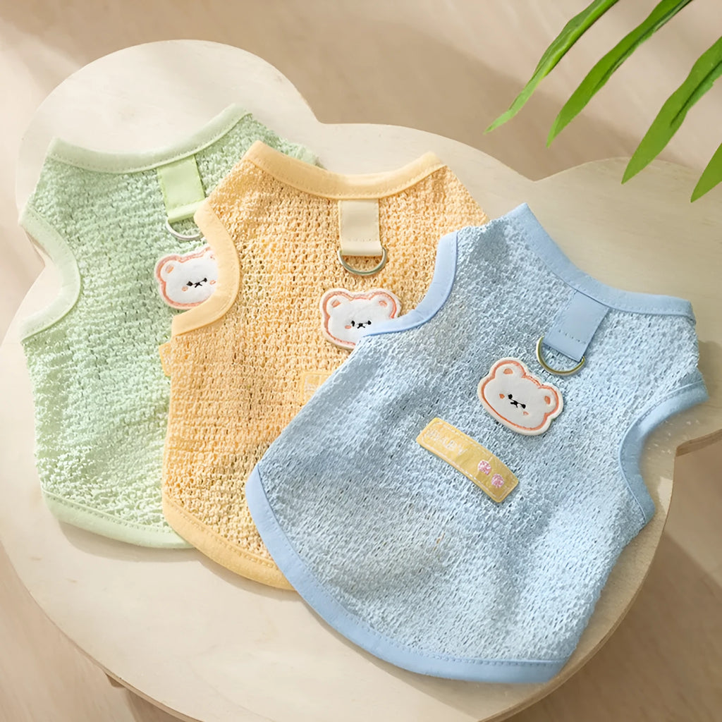 Cat wearing hollowed-out breathable clothes with bear patch in knitted fabric