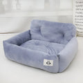 Grey and blue plaid cloth car-mounted pet nest bed for small dog travel.