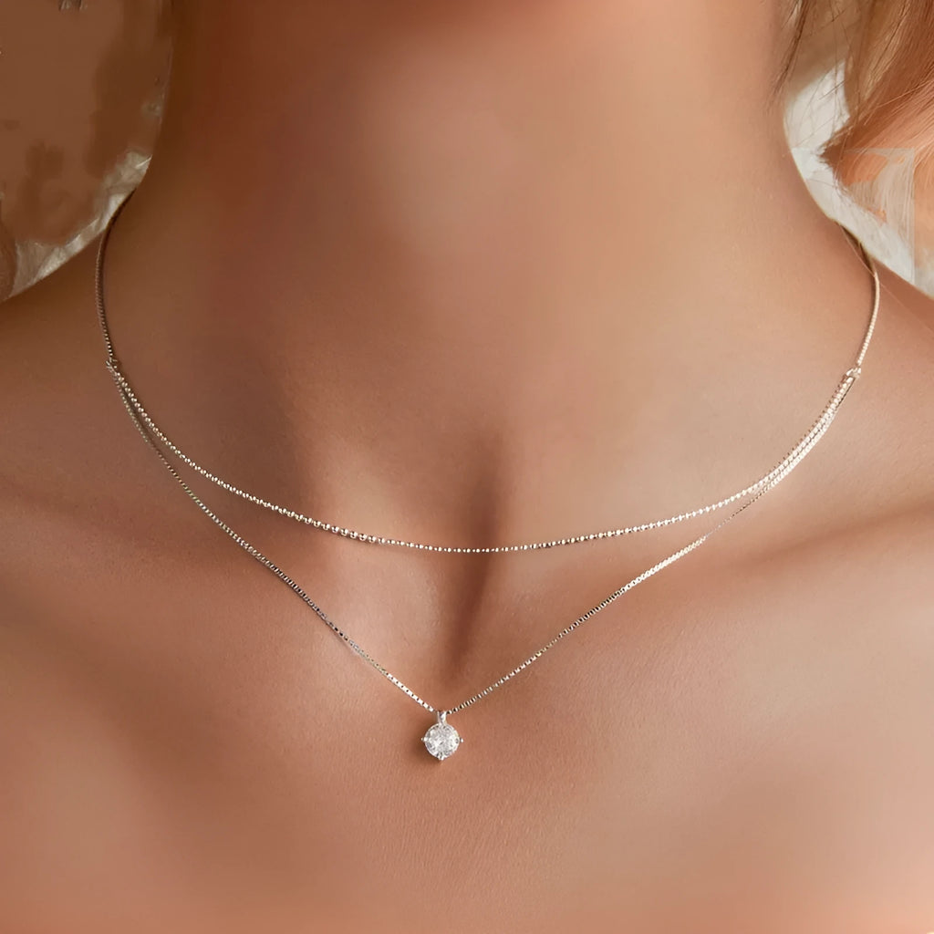 Double-layer sterling silver necklace with pearl chain and adjustable clasp