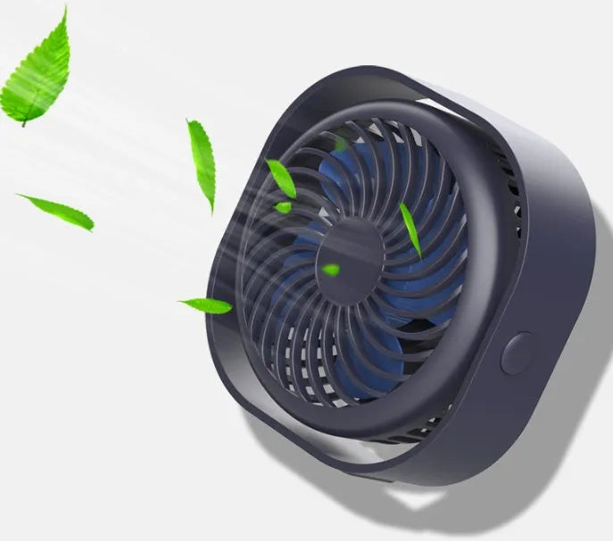 USB desk fan with 360-degree rotation in blue, on a desk next to a laptop.