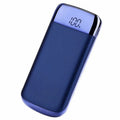 Portable power bank with LCD display showing battery percentage and two USB charging ports