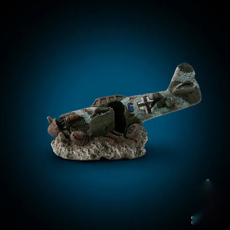Resin aquarium ornament simulating aircraft wreckage, dimensions 8cm by 4.5cm by 4.5cm