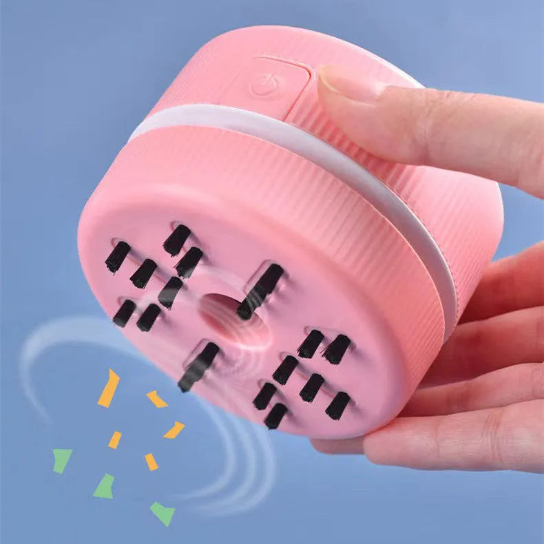 Pink and blue mini handheld desktop vacuum cleaner for pencil shavings and fine debris