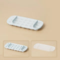 High-capacity food-grade ice cube tray in blue with integrated ice shovel storage.