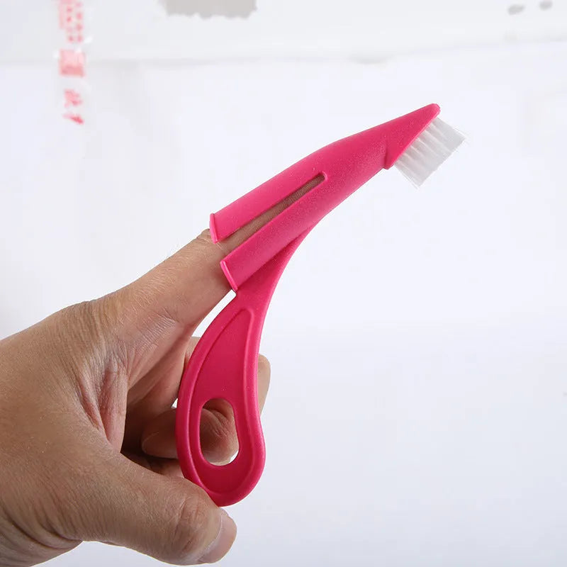 Red and white pet finger toothbrushes with silicone bristles for cleaning dog and cat teeth.