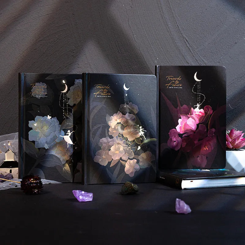 A5 notebook with luminous holographic cover open to show colour illustration on inside pages.
