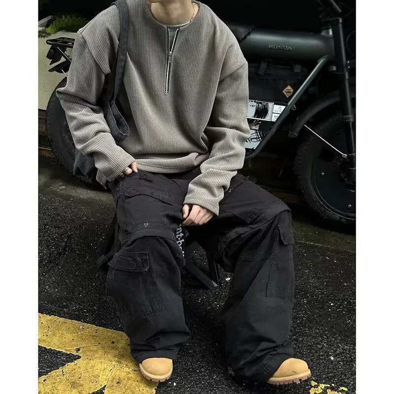A solid colour loose pullover top for women in grey, shown as a layering piece.