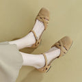 Women's apricot retro Roman sandals with a buckle closure and round toe on a light background.