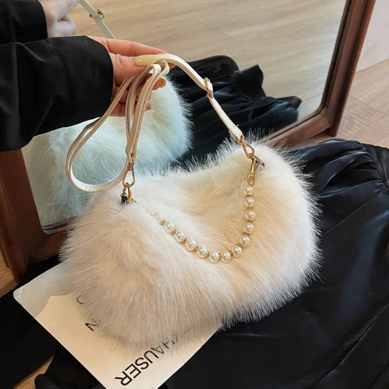 Plush shoulder bag with pearl chain, 27cm wide, shown in black for autumn winter commuting