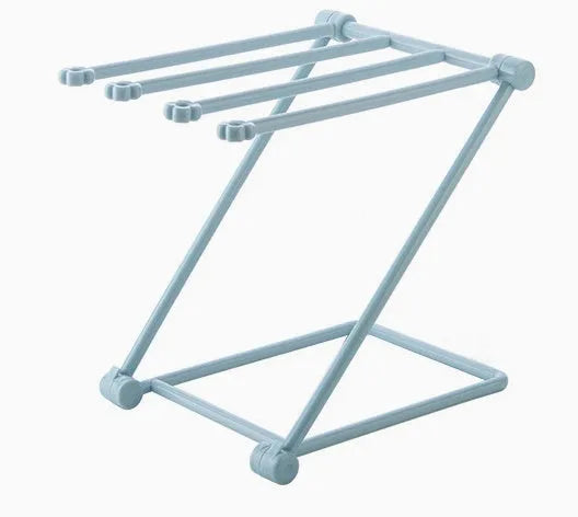 Foldable light grey plastic dishcloth shelf with vertical design mounted on a wall