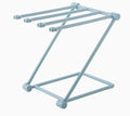 Foldable light grey plastic dishcloth shelf with vertical design mounted on a wall