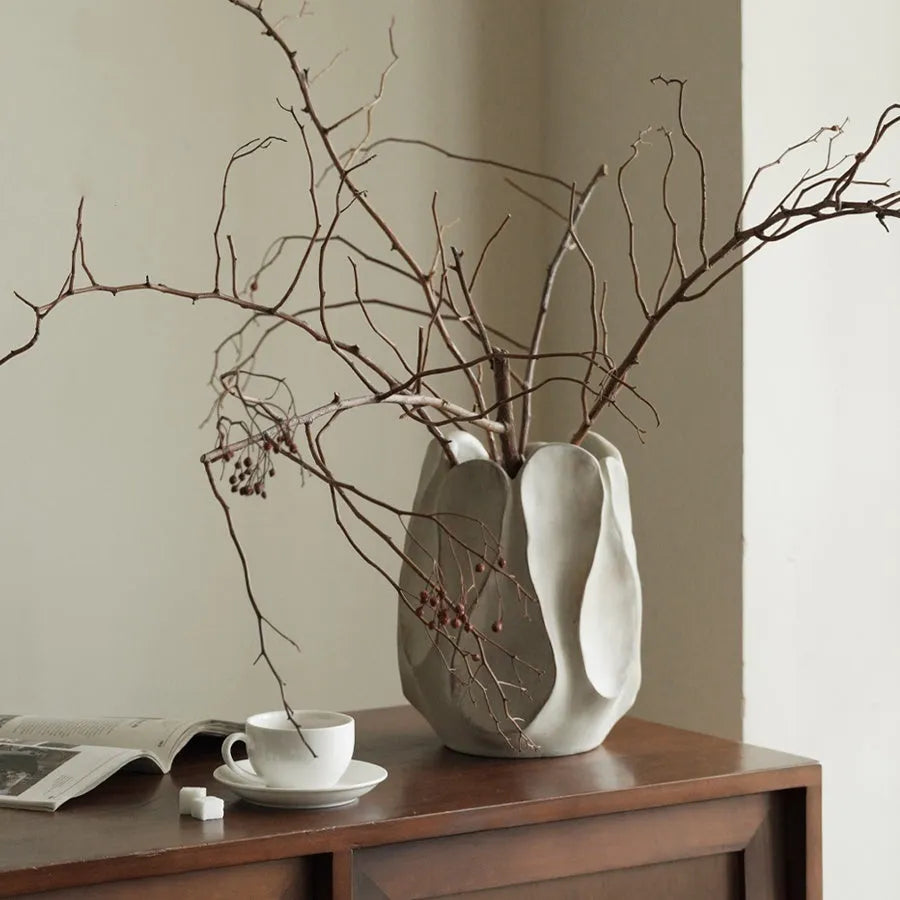 Irregular shaped ceramic vase for flower arrangements in art style with high and low versions