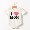 Short sleeve triangle romper in cotton with Love Mum and Love Dad prints, available in 59cm to 80cm suitable heights.