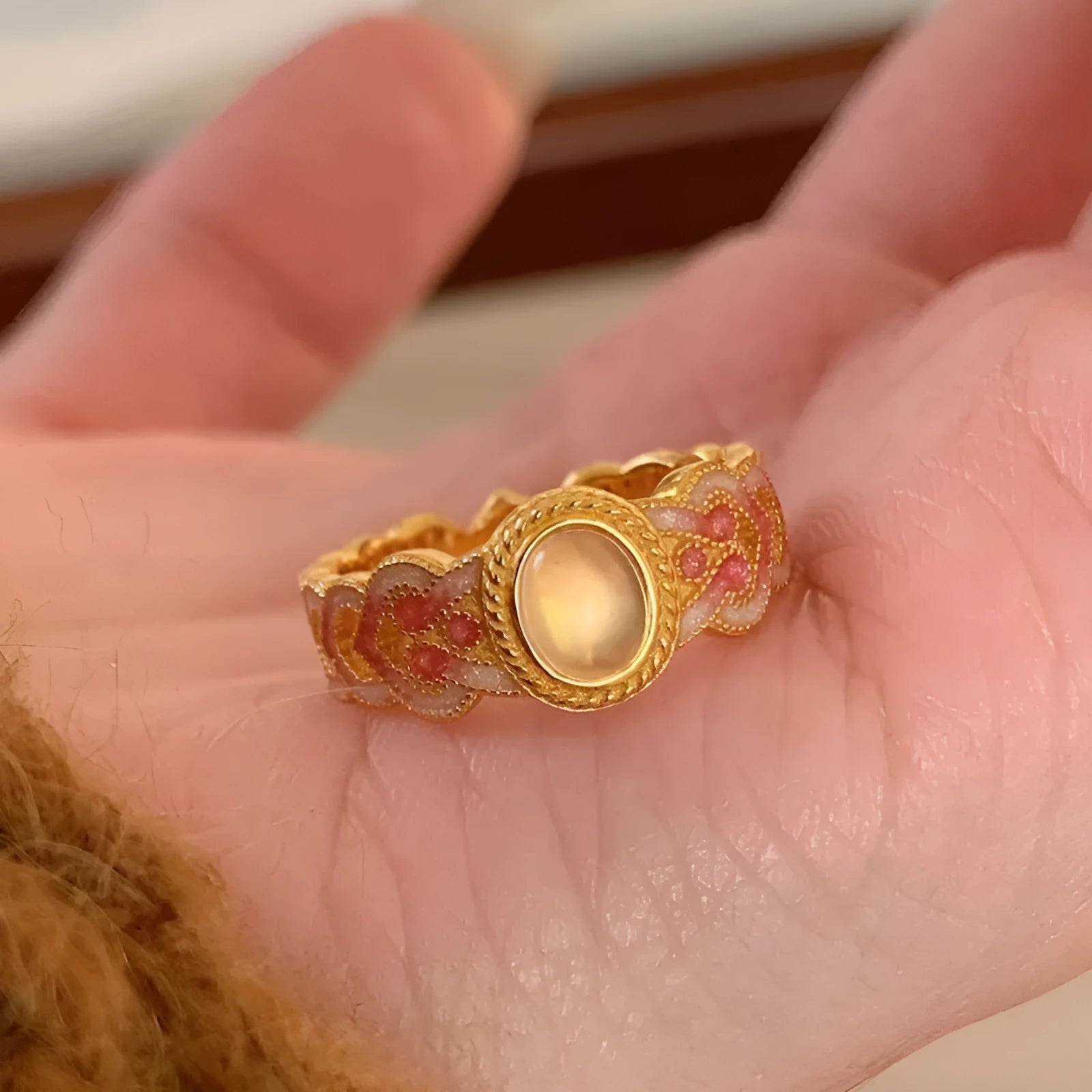Geometric open mouth ring with pink crystal enamel detailing on copper gold plated band