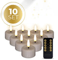 Four taupe-coloured LED tealight candles with a glowing 3D flame effect on a table.