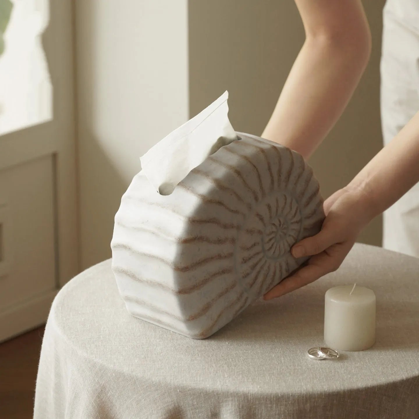 White resin tissue box cover with raised conch shell design