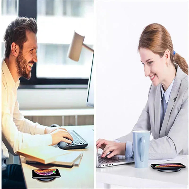 Black aluminium 15W Qi wireless fast charger for phones on a wooden desk.