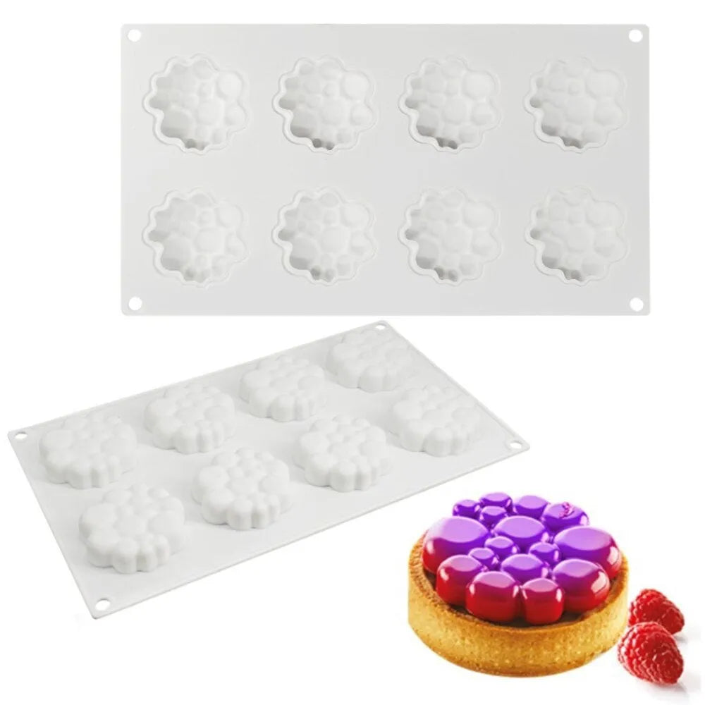 Round silicone cake mould with bubble tower pattern showing 8 raised decorative bubbles