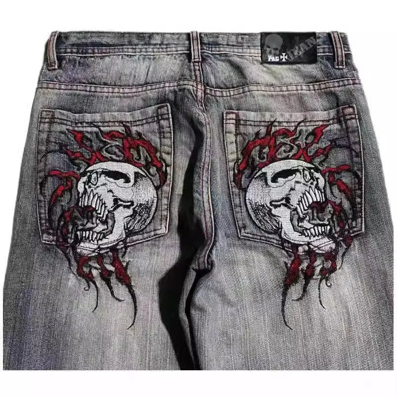Grey washed-out men's wide-leg jeans with a retro worn look on a mid waist.
