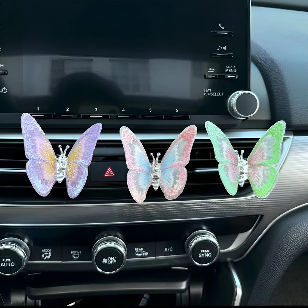 Embroidered fabric butterfly car air vent decoration showing colour options and mounting clips
