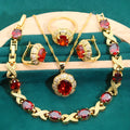 Gold plated jewellery set with coloured cubic zirconia stones, showing necklace, earrings, bracelet, and ring.