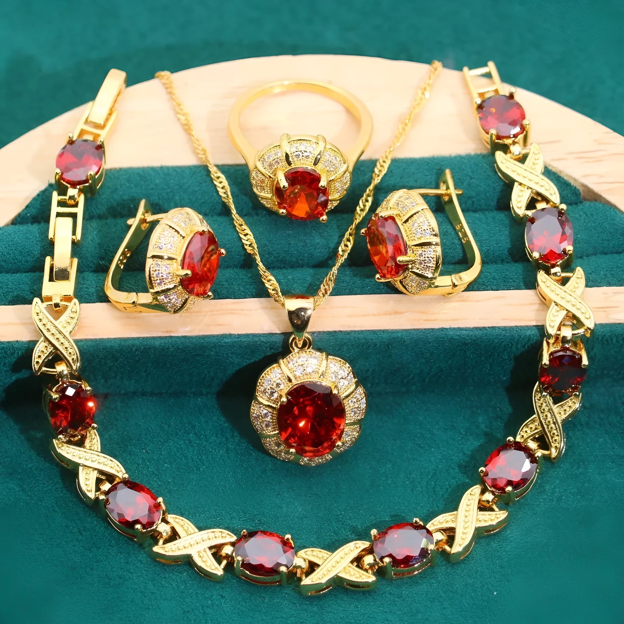 Gold plated jewellery set with coloured cubic zirconia stones, showing necklace, earrings, bracelet, and ring.