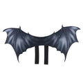 Black cloth bat wings costume accessory for a dog or cat on a Halloween background.