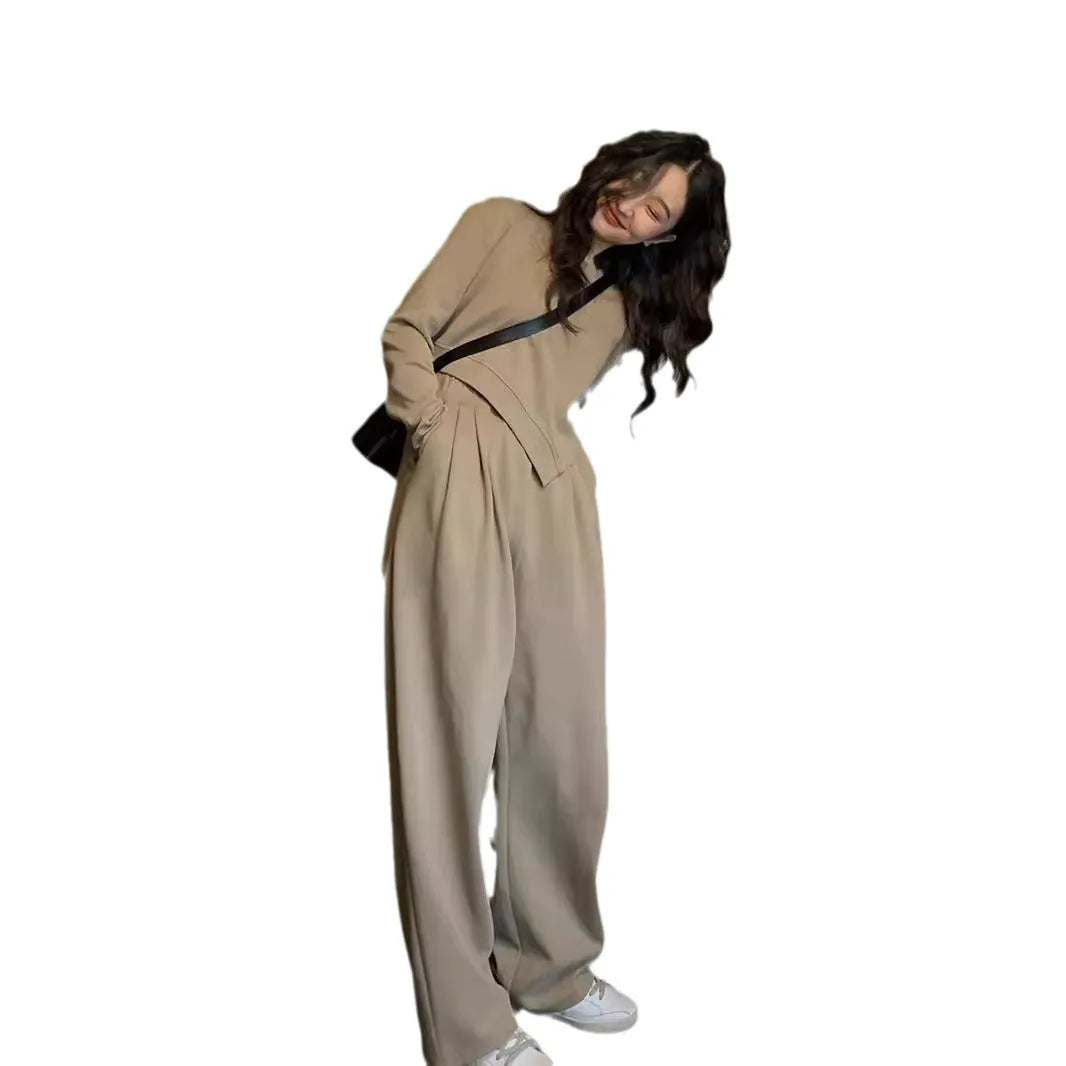 Women's khaki loose-fit polyester sports suit with long sleeves and full-length trousers.