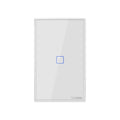 White tempered glass smart touch wall switch with single gang design on a wall