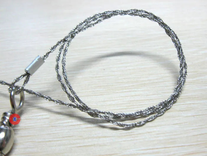 Stainless steel survival wire saw with pull rings showing 55cm cutting blade and extended 70cm total length
