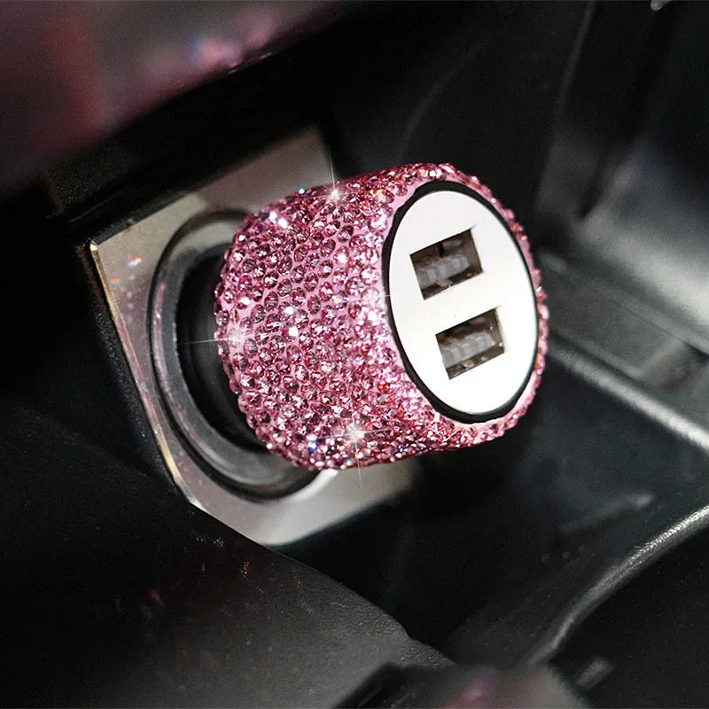 Dual USB car charger with diamond-pattern finish plugged into a car cigarette lighter socket