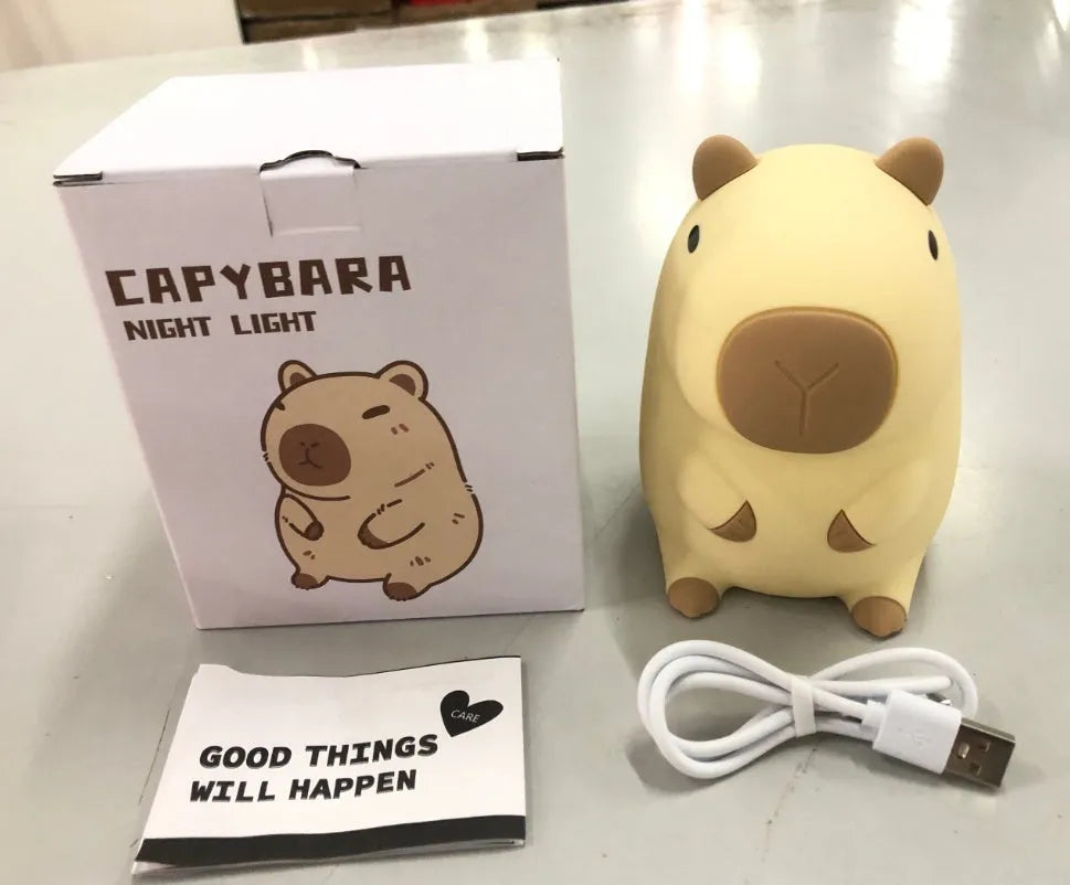 Capybara-shaped silicone night lamp with USB charging port and compact dimensions