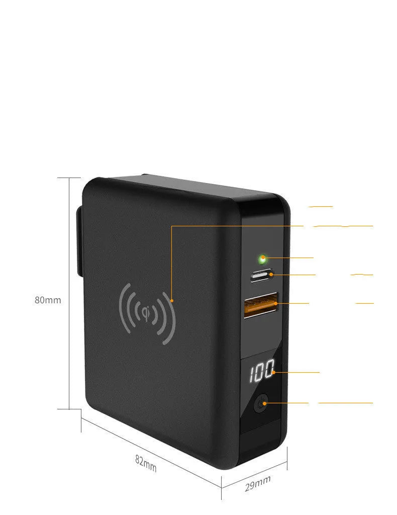 Black Super QI power bank with folding AC plug unfolded, showing wireless charging surface on top.