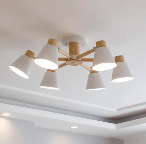 Nordic creative macaron-shaped ceiling pendant light with multiple bulbs in an ironwood frame.