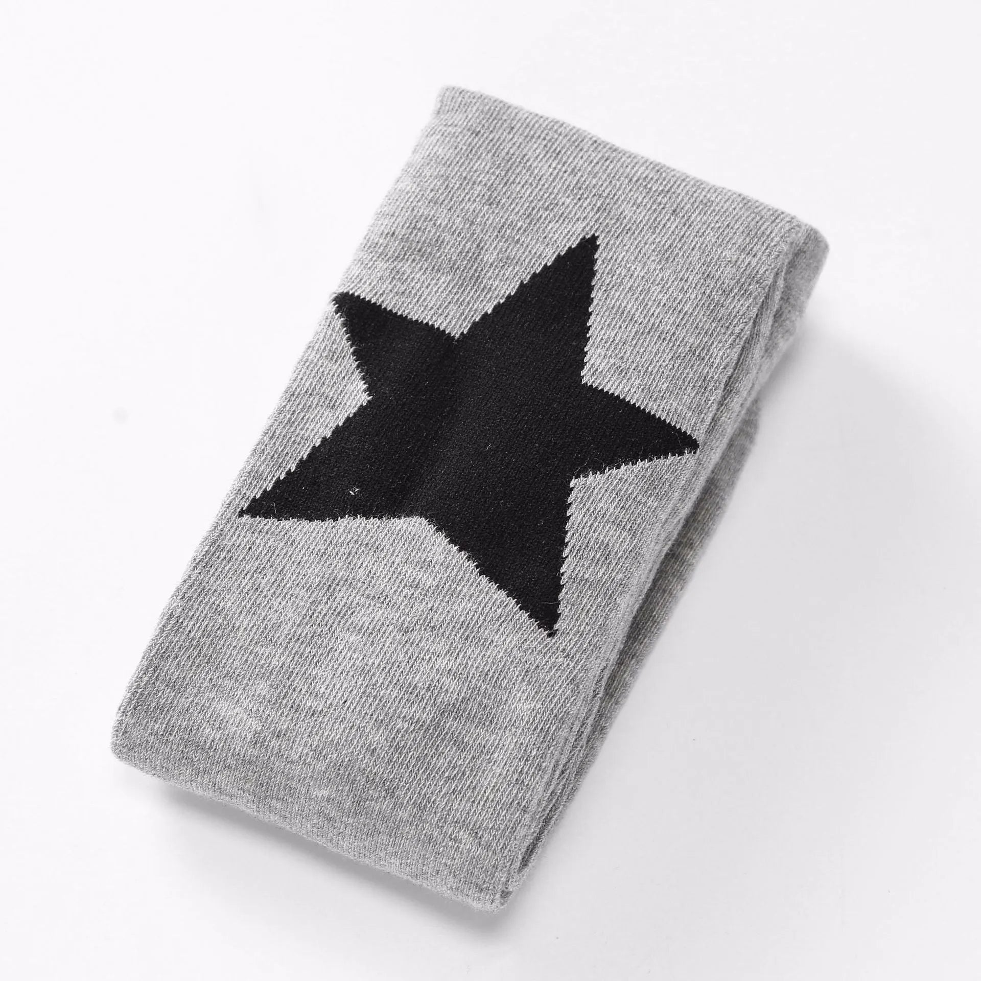 Girl's cotton leggings with five-pointed star and heart patterns in solid colour design
