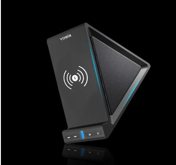 Black multifunctional Bluetooth speaker with integrated mobile phone stand and wireless charging pad on a desk
