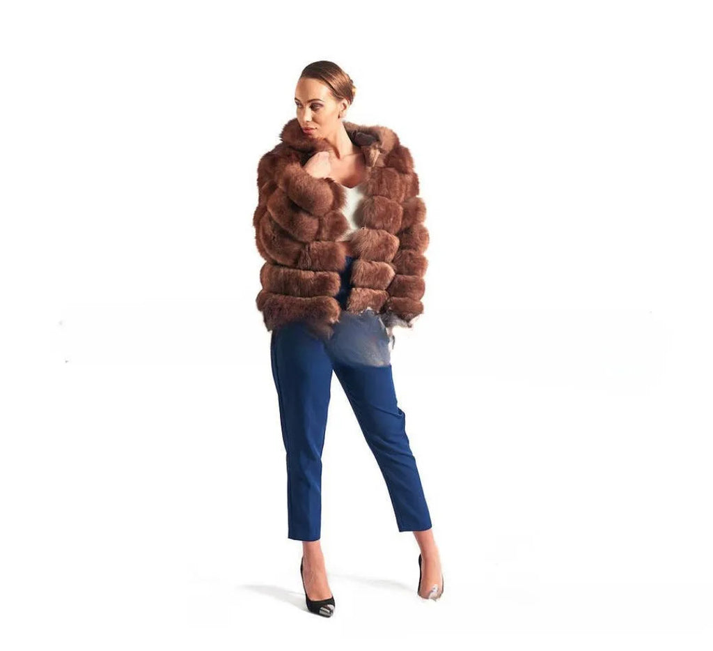Women's loose artificial fur hooded coat in brown on a model, showing street fashion style.