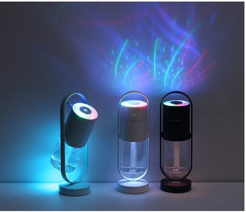 Pink Magic Shadow USB air humidifier with projection night lights on a wooden table.