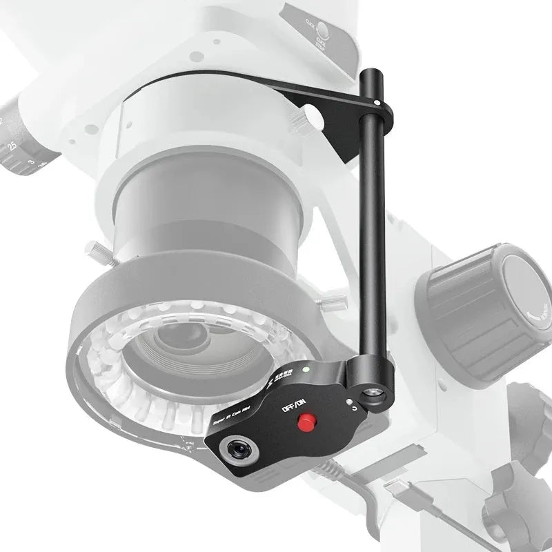 Mini microscope thermal imaging camera with tuner lens, extension bracket, and mounting tools on a workbench.